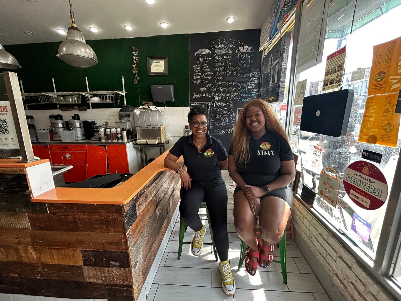 Workers smile in a cafe