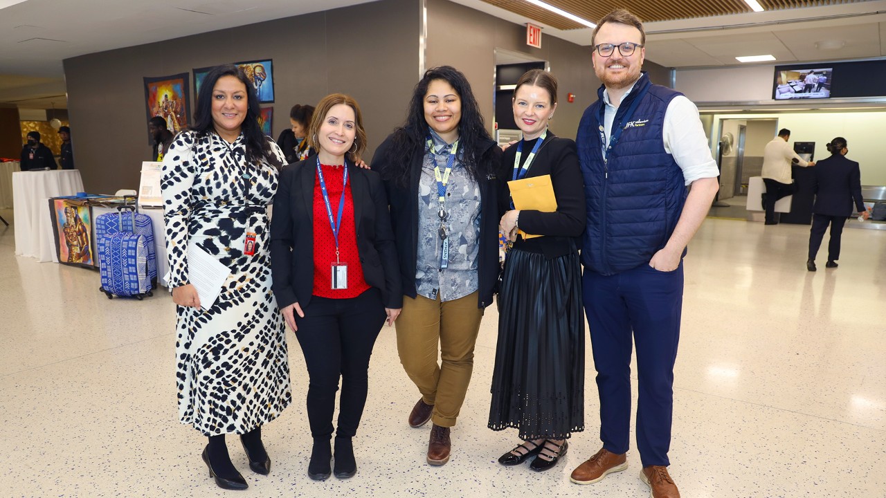 JMP Terminal 6 and Terminal 7 staff standing together and smiling
